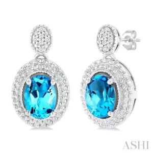 1/20 ctw Oval Cut 7X5MM Blue Topaz and Round Cut Diamond Semi Precious Earring in Sterling Silver