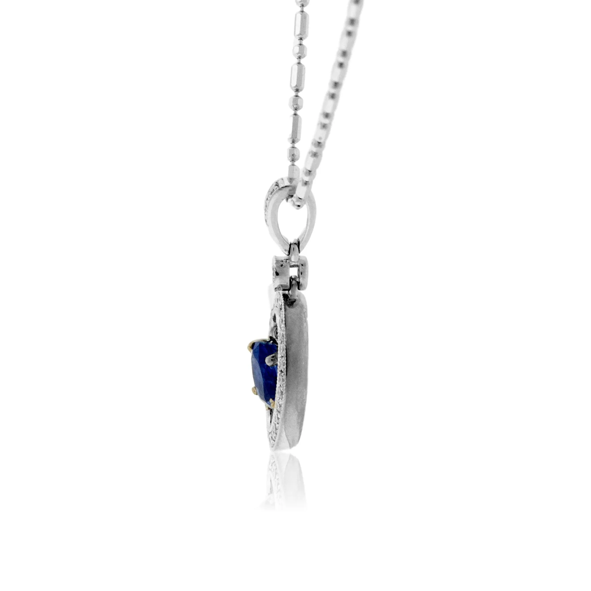 Oval Shaped Sapphire with Diamond Halo Pendant